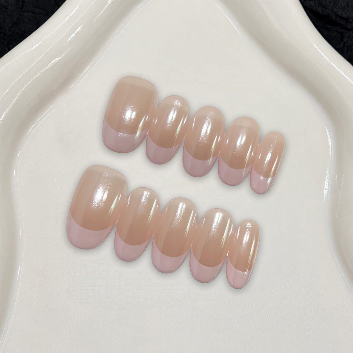 Pearl French tip press-on nails almond shape nude base pink tips glossy pearlescent handmade design