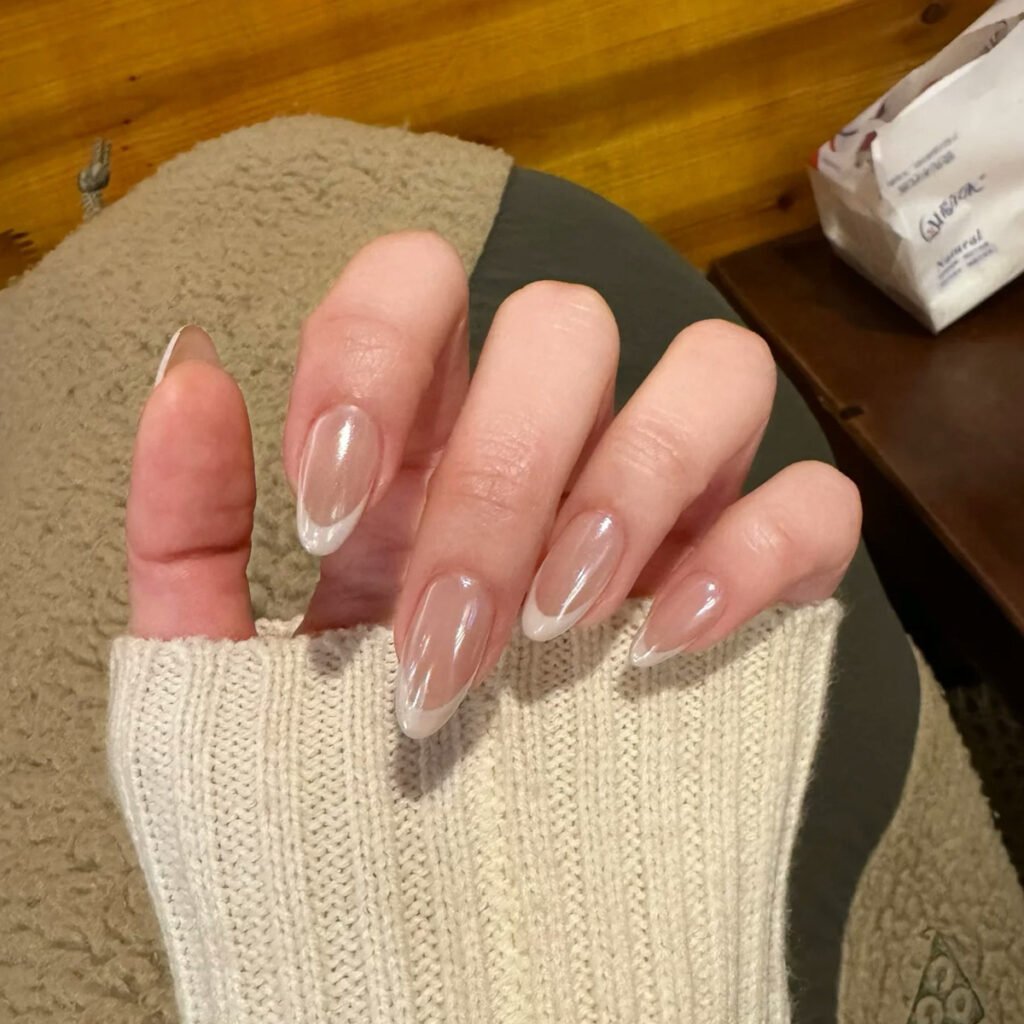 Natural French tip press-on nails almond shape nude base white tips pearl finish glossy handmade design