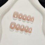 Natural French tip press-on nails almond shape nude base white tips pearl finish glossy handmade design