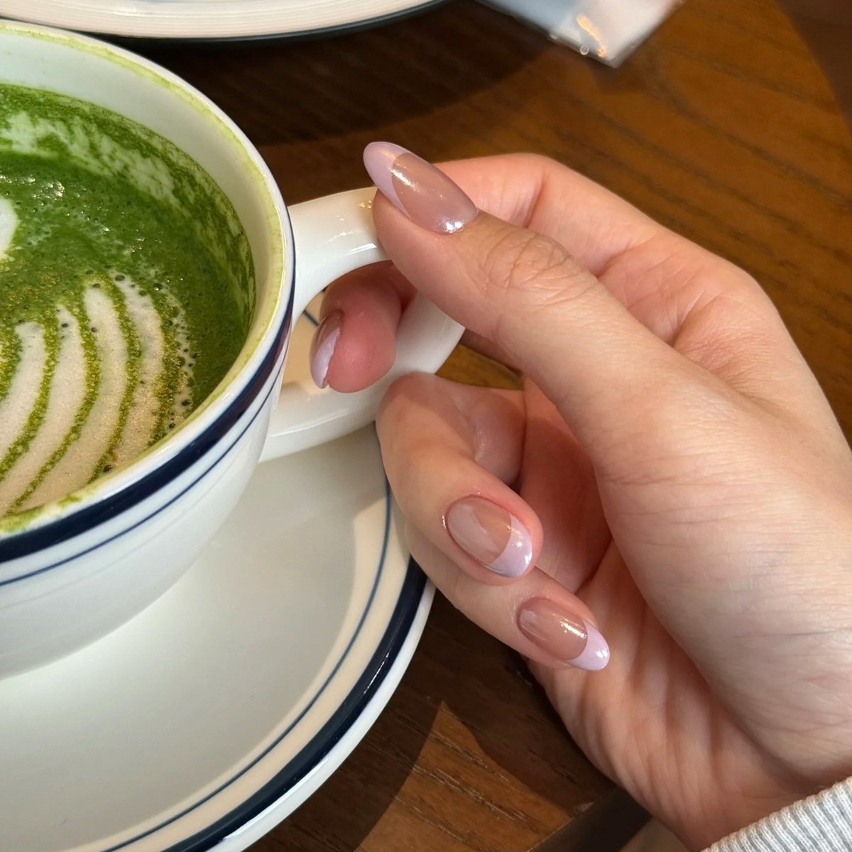 Pearl French tip press-on nails almond shape nude base pink tips glossy pearlescent handmade design